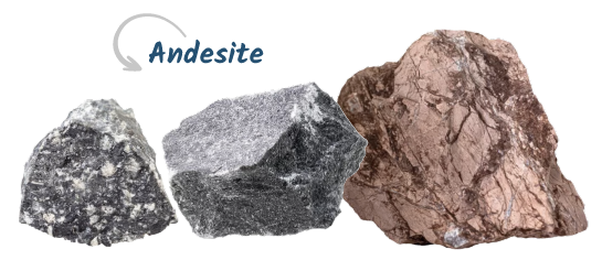 Three rocks placed side by side tell a story of the Copper Coast. The leftmost rock, labeled "Andesite" with an arrow pointing to it, is characterized by its distinct, speckled texture, contrasting with the smoother appearance of the other two rocks.